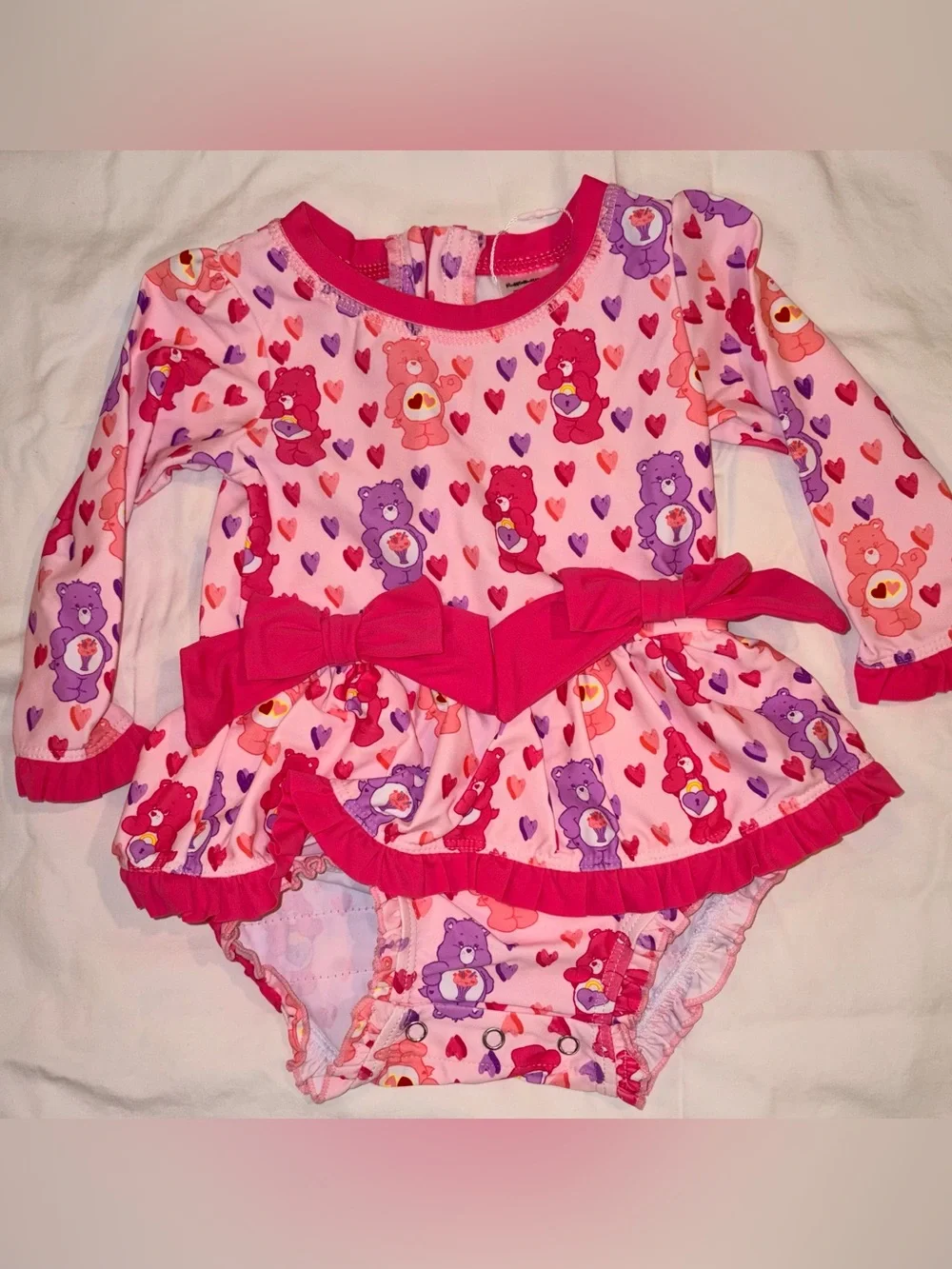 Ruffle Butts X Care Bears long sleeve 1 piece swimsuit/rashguard sz 12-18 mo NWT